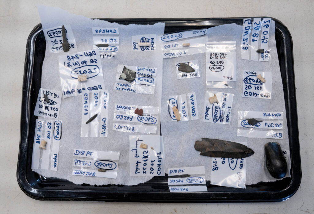 Artifacts excavated from the Nunalleq dig site in Quinhagak, Alaska are processed inside the Nunalleq Museum on June 10, 2026.