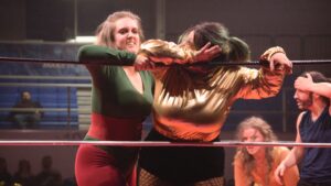 A women’s pro wrestling troupe in Fairbanks rings in 10 years of bodyslams and bruises